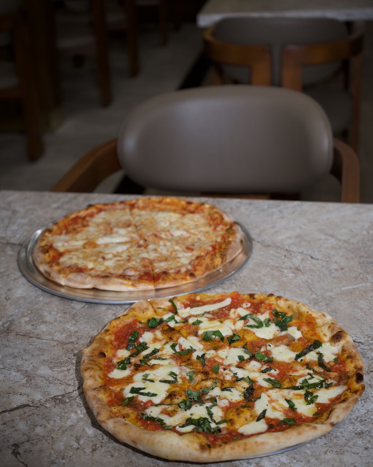 Two stone-baked pizzas fresh from the oven
