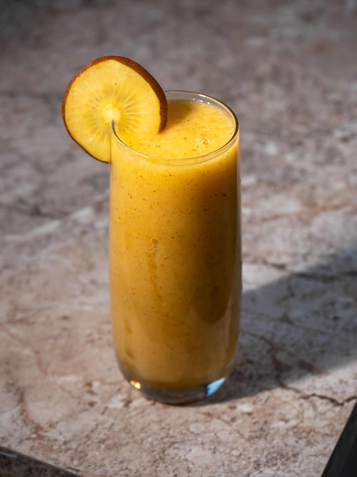 A mango smoothie finished with fresh fruit